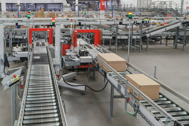 istock packing line in a logistics warehouse. conveyor belt in a modern production line 2189401088