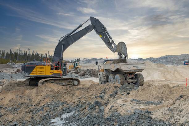 istock An excavator loads a dump truck 2189402086