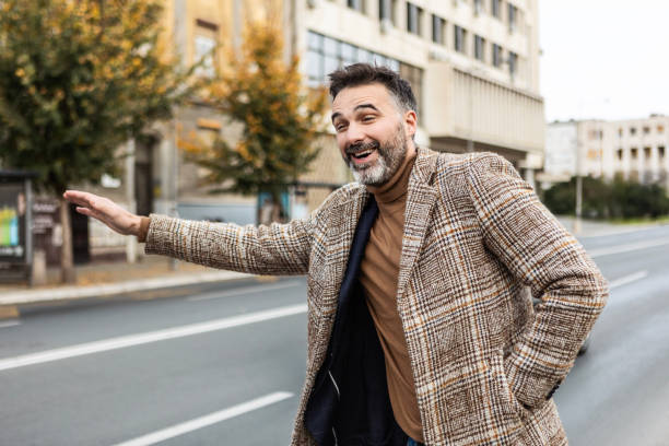 istock Business man hailing a taxi 2189402199
