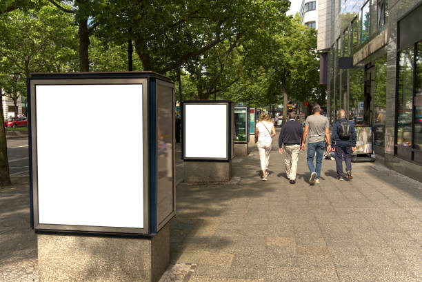 istock White billboard on a street in Berlin, several people. 2189404931