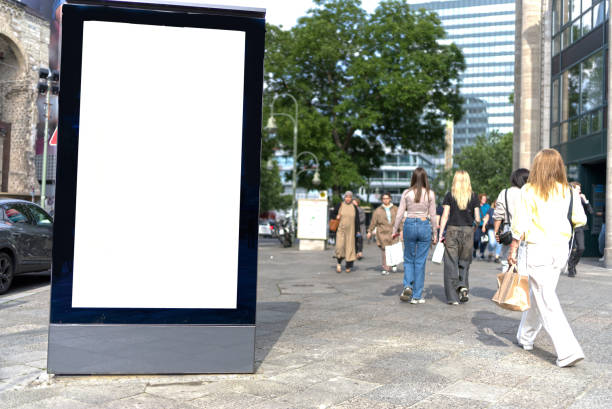 istock White billboard on a street in Berlin, several people. 2189404945