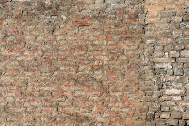 istock Damaged brick structure surface of the ancient city wall. 2189405499