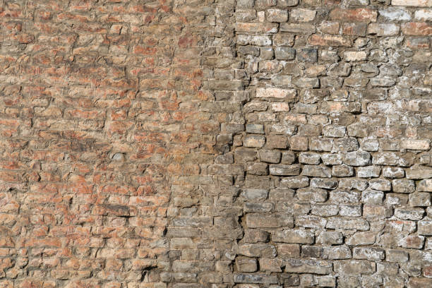 istock Damaged brick structure surface of the ancient city wall. 2189405543