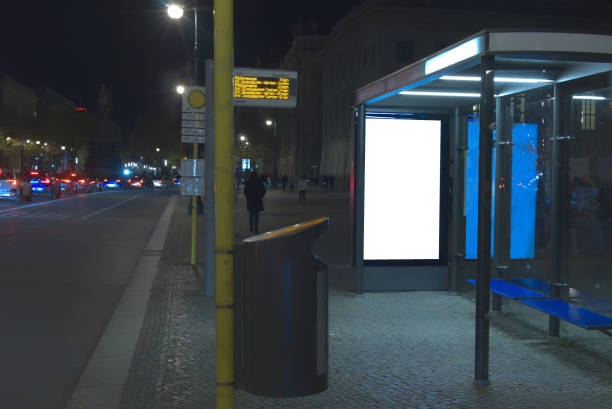 Billboard or display at a bus stop at night in Berlin.