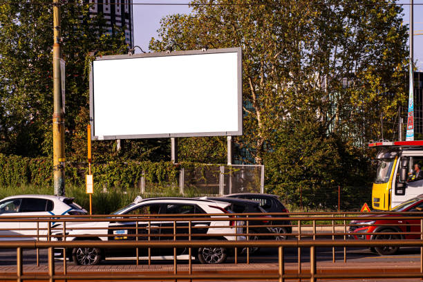 A wide-format billboard on a street in Milan.