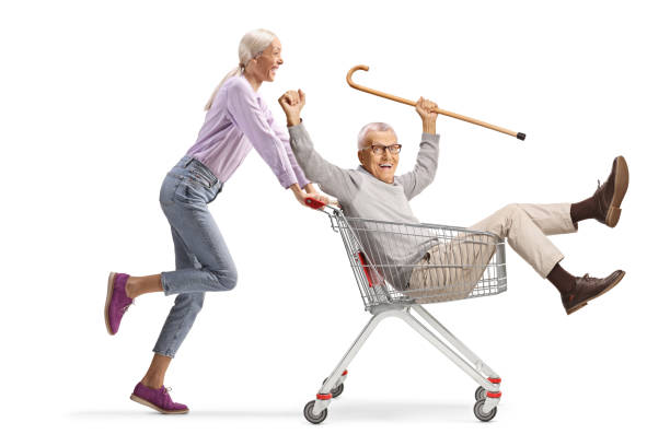 istock Woman pushing her elderly father inside a shopping cart 2189408149