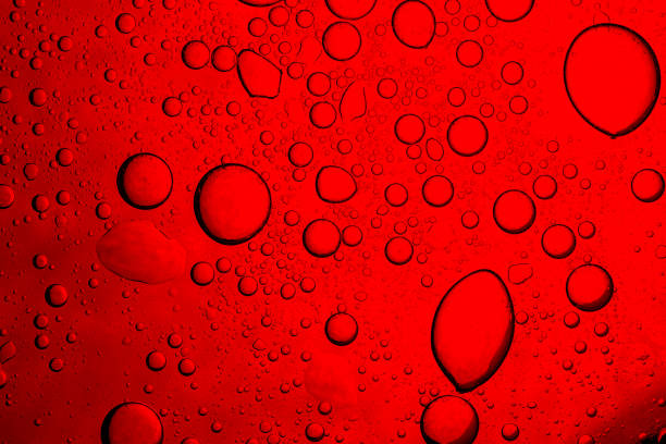 istock Red macro drink texture,Red close-up macro drink water drop surface,Water droplets on a glass of red cold drink for background and texture 2189408849