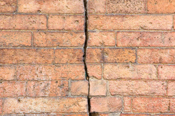 Cracked brick wall. Close-up. Background. Texture.