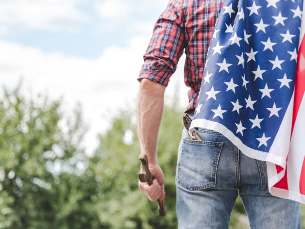 istock American Flag, attractive man in work clothes 2189414675