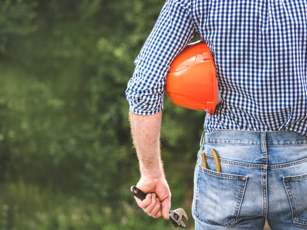 istock Attractive man in work clothes with a protective helmet 2189414719