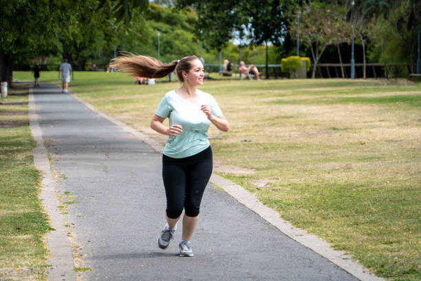 istock Young woman doing exercises outdoors 2189416206