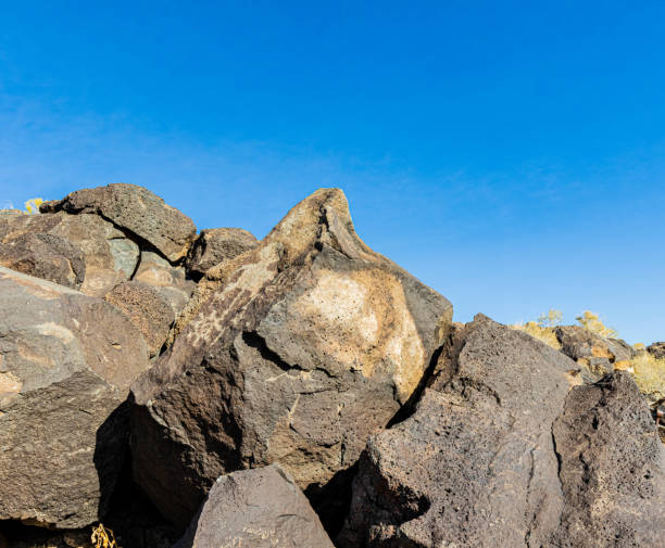 Ancient Carvings on Mesa Point Trail in Boca Negra Canyon, Ancient Carvings on Mesa Point Trail in Boca Negra Canyon, Petroglyph National Monument, Albuquerque, New Mexico, USA albuquerque volcanoes stock pictures, royalty-free photos & images