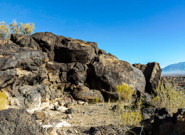 Ancient Carvings on Mesa Point Trail in Boca Negra Canyon, Ancient Carvings on Mesa Point Trail in Boca Negra Canyon, Petroglyph National Monument, Albuquerque, New Mexico, USA albuquerque volcanoes stock pictures, royalty-free photos & images