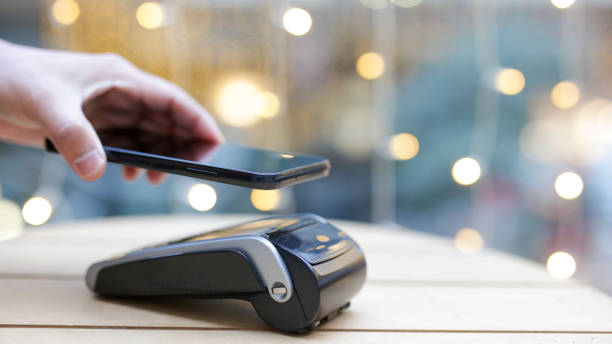 istock Customer paying with nfc technology on smartphone in a restaurant 2189418095