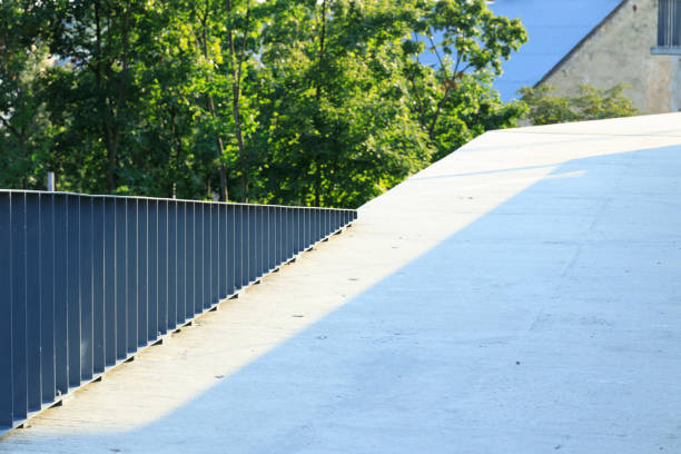 urban cement square platform architecture design geometrical pattern with metallic fence gray city scape background