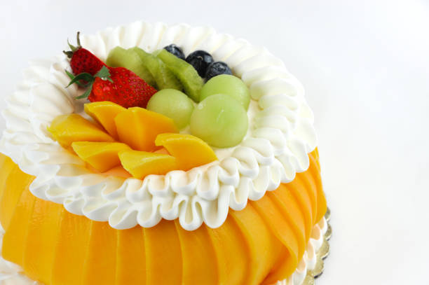colorful fruit birthday cake isolated on white background