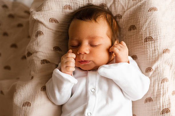 istock Baby sleeping in bed closeup 2189424069