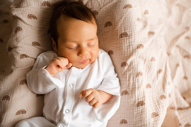 istock Baby boy lying in bed closeup 2189424126