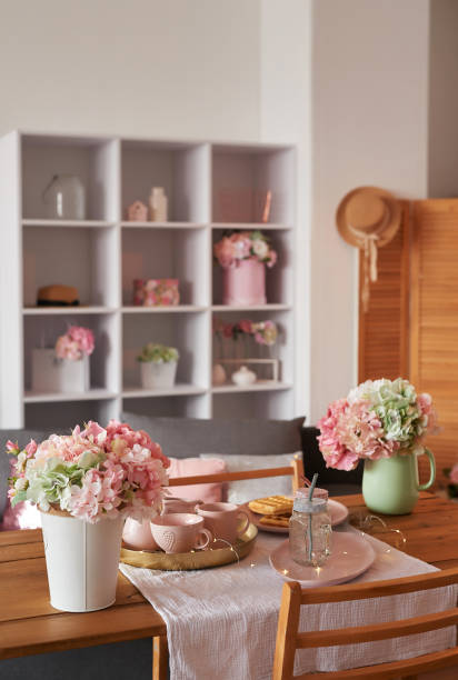 istock Pink kitchen. Studio apartment. Loft interior. Shelves and spring decor in room. Rent and delivery of housing. Hostel and hotel. Valentine's day, mother's day 2189426430