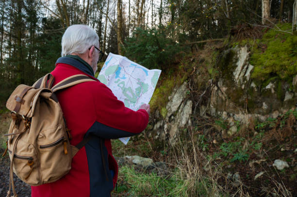 istock Retired man looking at a map in a rural location 2189428225