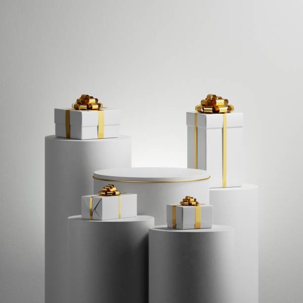 istock 3d render. Abstract minimalist white background. Wrapped gift boxes with gold ribbons placed on high podiums. Holiday showcase, mockup for product presentation 2189432537