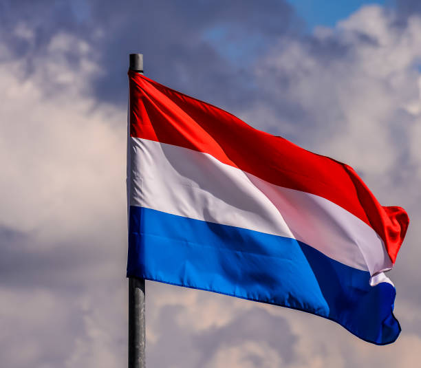 istock A red, white, and blue flag is flying in the sky 2189434931