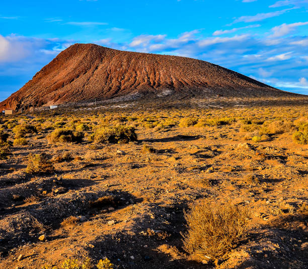 istock A desert landscape with a large hill in the background 2189434933