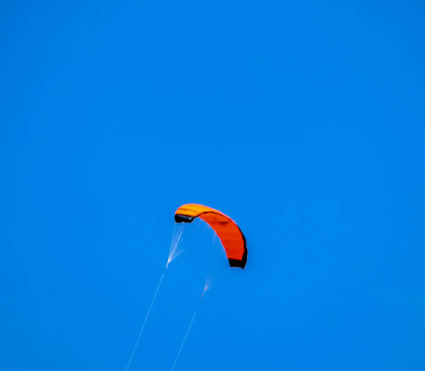 istock A kite is flying in the sky with a blue background 2189434964