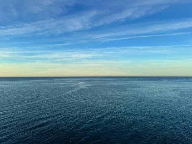 istock Open sea calm blue water and sky horizon 2189435905