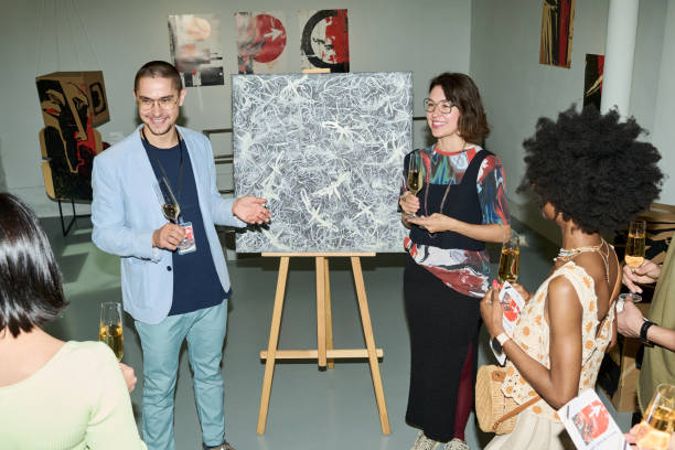 istock Man presenting new artwork to public 2189437647