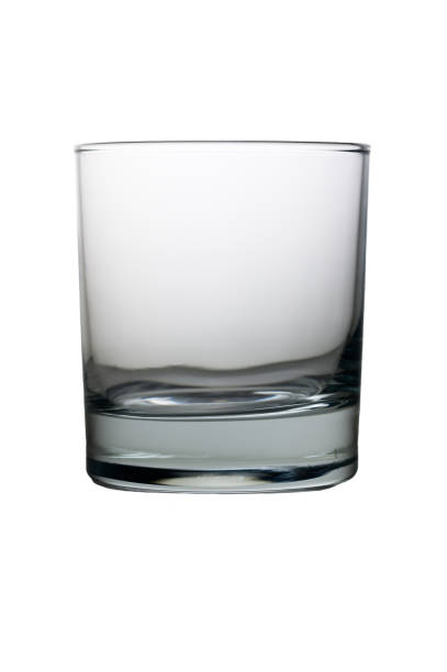 A simple yet elegant glass tumbler awaits, reflecting soft light, showcasing its minimalist design and clarity.
