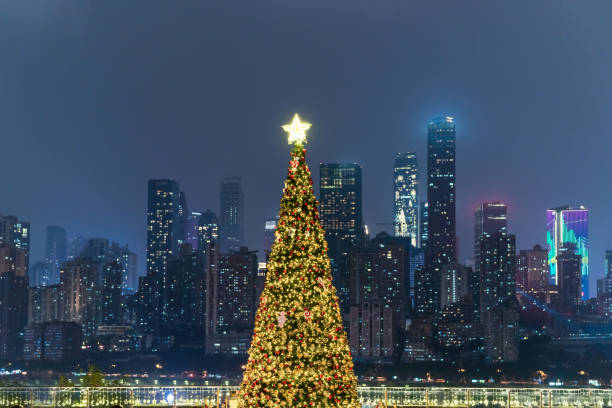 istock decorated christmas tree with modern cityscape and skyline, sky for copyspace. 2189438122