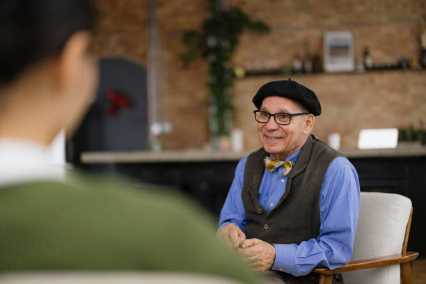 Senior Man Engaged in a Warm Conversation in a Cozy Interior Setting