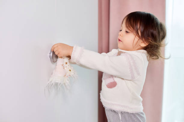 istock child girl decorates her room before Christmas 2189442790