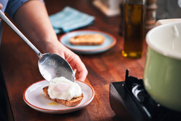 Poached Egg on Brown Bread Served with Ham, Avocado and Sauce Hollandaise