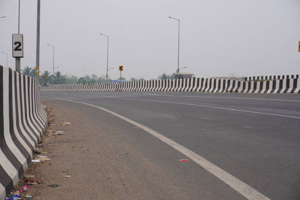 istock Highway overbridge taking right turn sign board with street lights 2189446159