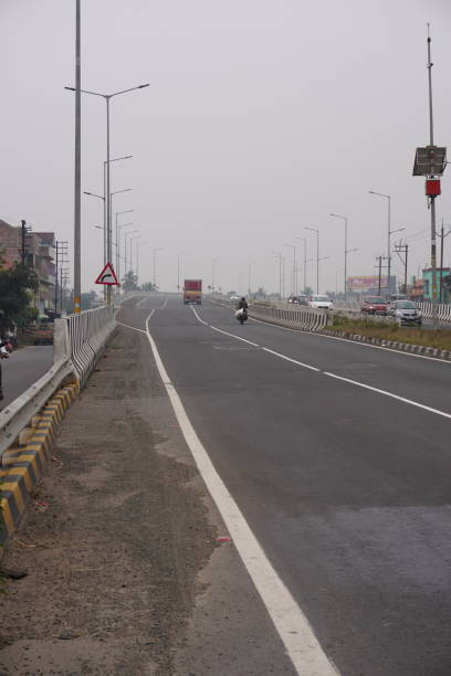 istock Bikes and trucks are running away on the highway flyover 2189446742