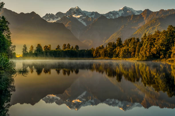 istock Mystical Lake Matheson reflections in dawn mist 2189450334