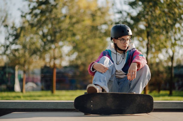 istock Young skater resting after practicing at skatepark 2189450613