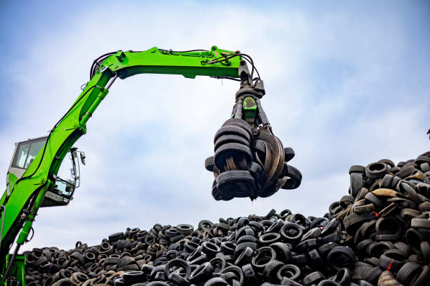istock Powerful green material handler operating in a tire recycling yard 2189452237