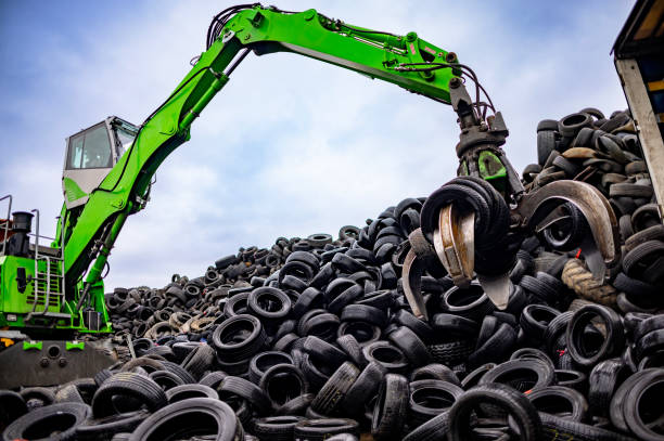istock Durable machine maneuvering through piles of tires 2189452353