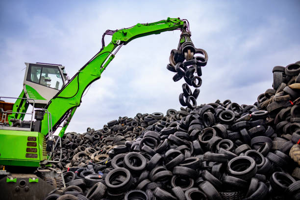 istock Powerful green material handler operating in a tire recycling yard 2189452422