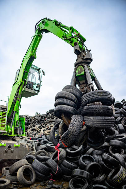 istock Durable machine maneuvering through piles of tires 2189452512