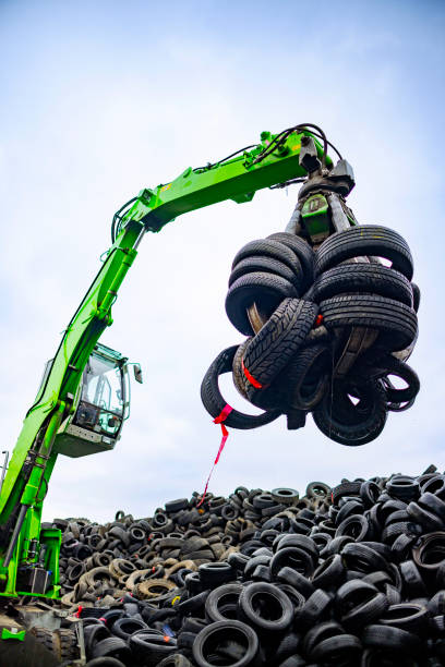 istock Picking up tires for recycling 2189452567