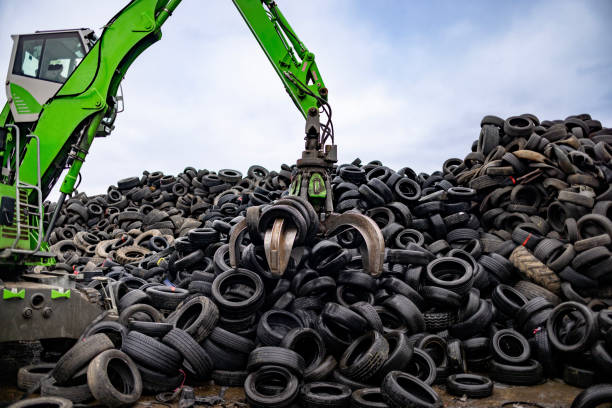 istock Picking up tires for recycling 2189452610