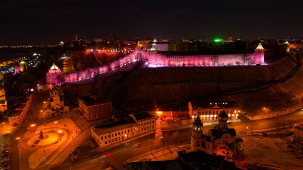 istock City at night with a large wall lit up in pink 2189453684