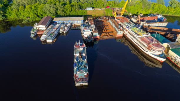 istock Large ship is docked at a pier with several other ships in the background 2189453817