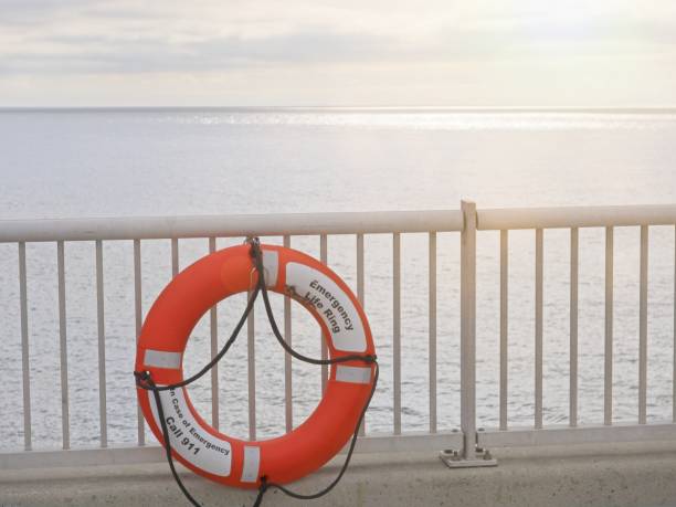 istock Sun glow on fishing pier with life saving ring 2189453853