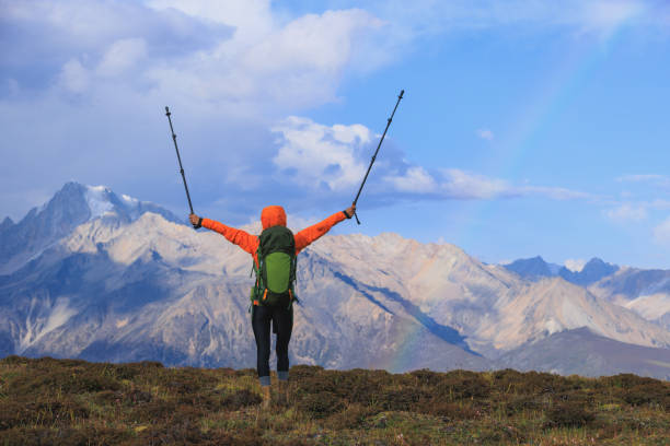 Woman hiking on high altitude mountain top