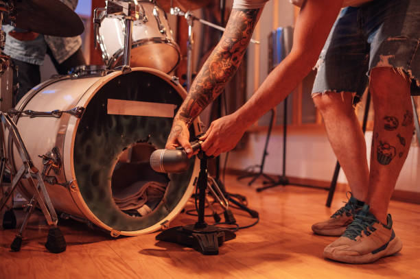 istock Close up sound engineer adjusting microphone for drums recording in studio 2189455047